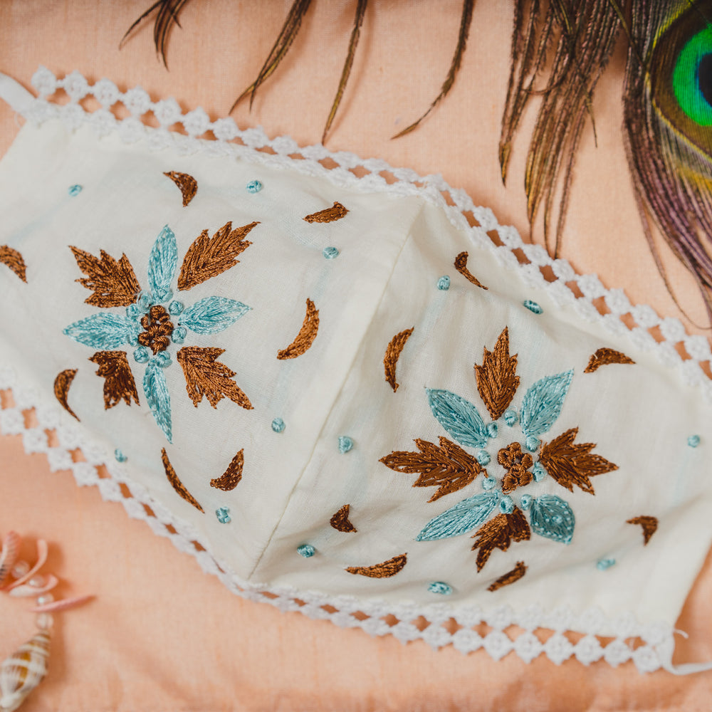 
                  
                    Geometrical Floral Embroidery on Cream Cotton Face Mask with Lace - Maxim Creation
                  
                