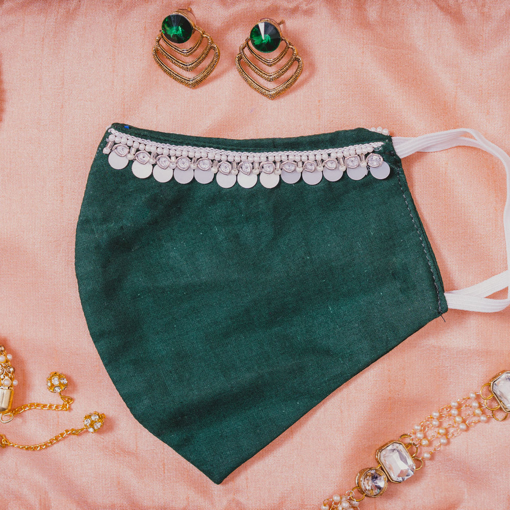 
                  
                    Bottle Green Coloured Cotton Face Mask with Hanging Tassel Embroidery - Maxim Creation
                  
                