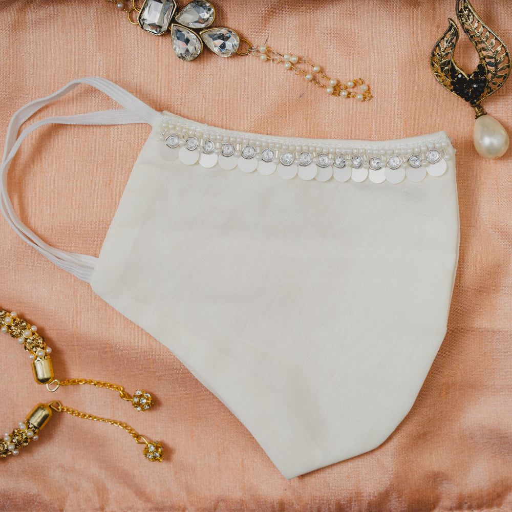 
                  
                    Cream Coloured Cotton Face Mask with Hanging Tassel Embroidery - Maxim Creation
                  
                