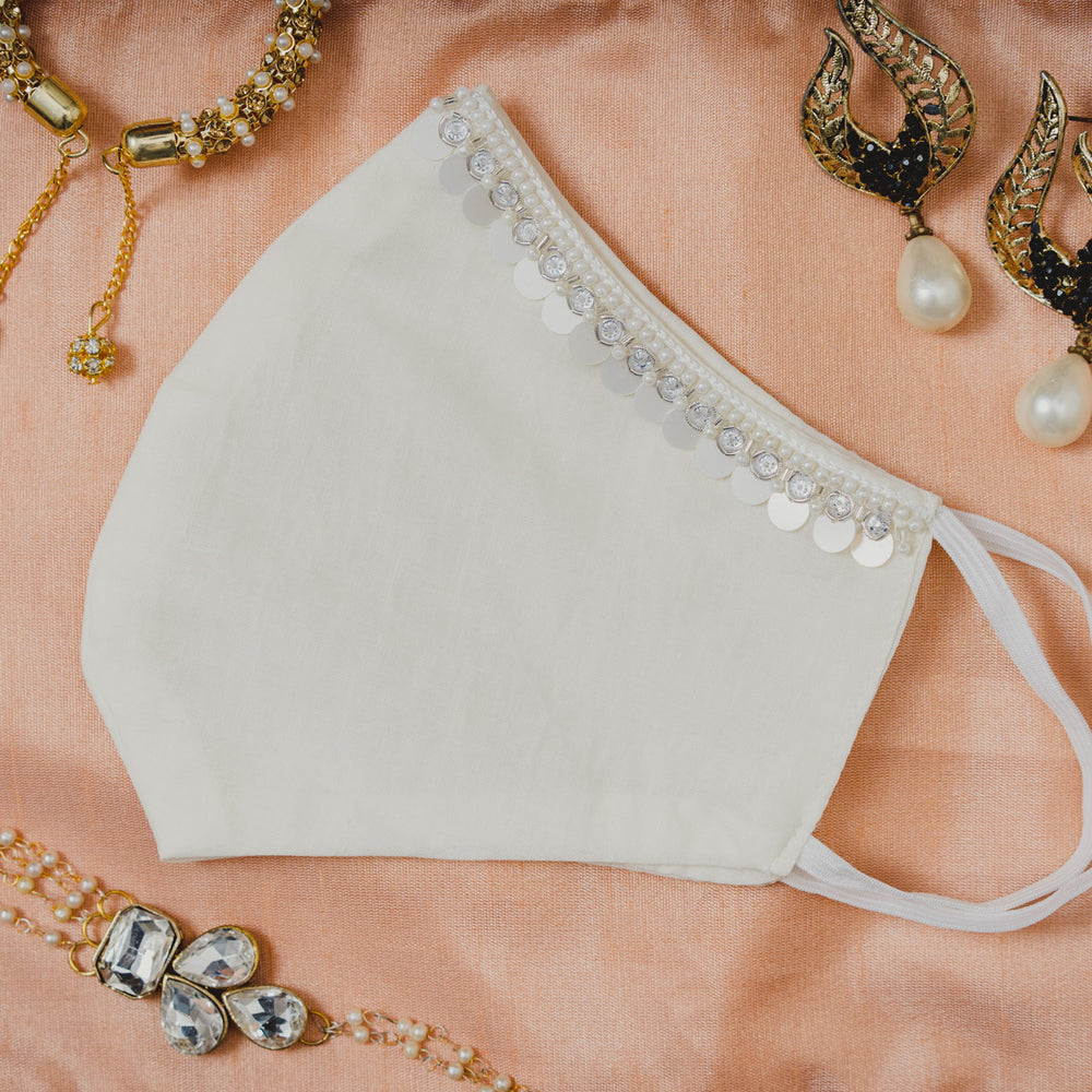 
                  
                    Cream Coloured Cotton Face Mask with Hanging Tassel Embroidery - Maxim Creation
                  
                